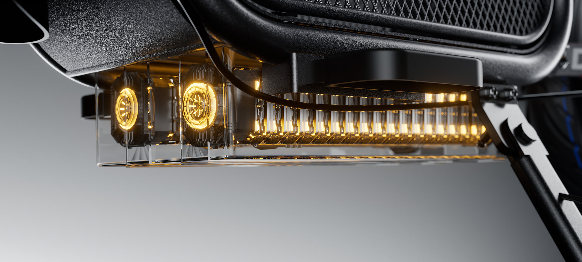 Close-up of a transparent electric vehicle battery compartment glowing with amber light, revealing internal cylindrical cells and cooling fans.