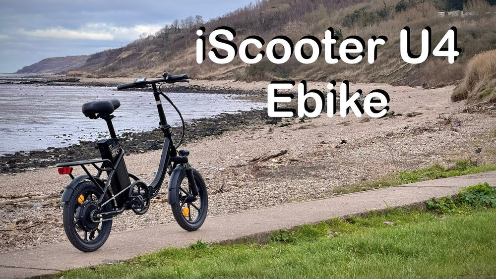 Folding electric bike set up for everyday rides iScooter U4 folding electric bike near the coast