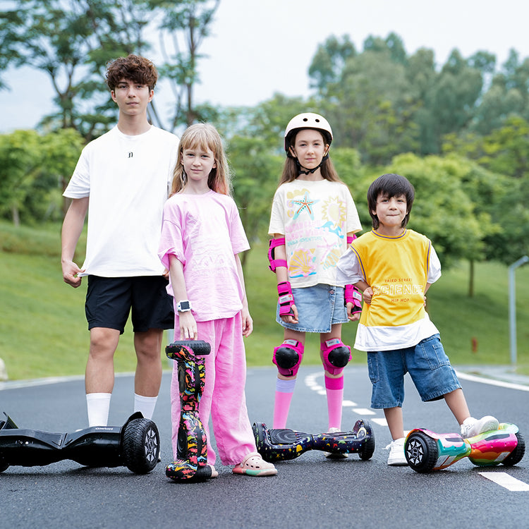 This studio shot displays two perspectives of a pink iHoverboard, one shown alone and the other equipped with a black K3 go-kart attachment featuring a seat and hand-operated steering levers.