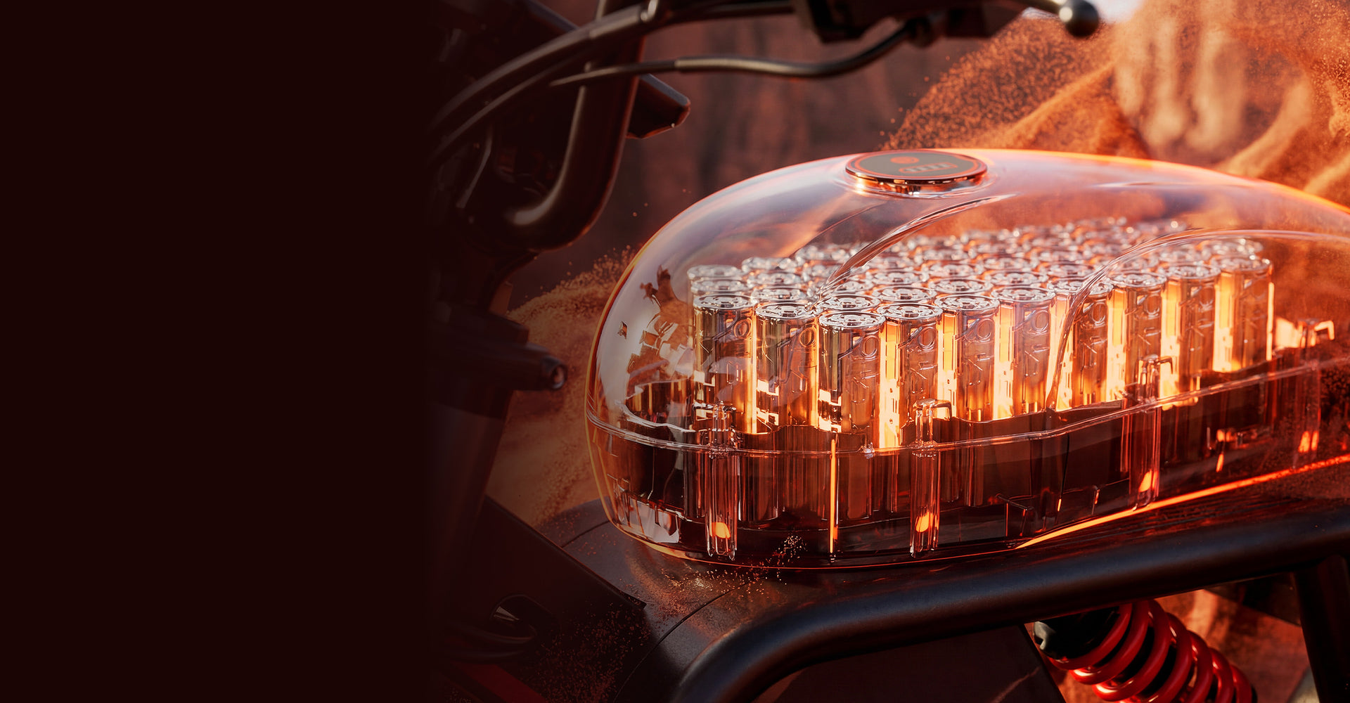 Wide-format promotional image of the iScooter DX5 Max electric bike battery system, featuring a transparent battery housing that reveals rows of illuminated battery cells inside. Warm orange lighting highlights the internal components, while part of the bike frame and rear suspension spring are visible beneath. The panoramic composition emphasizes battery capacity, power, and advanced energy technology.