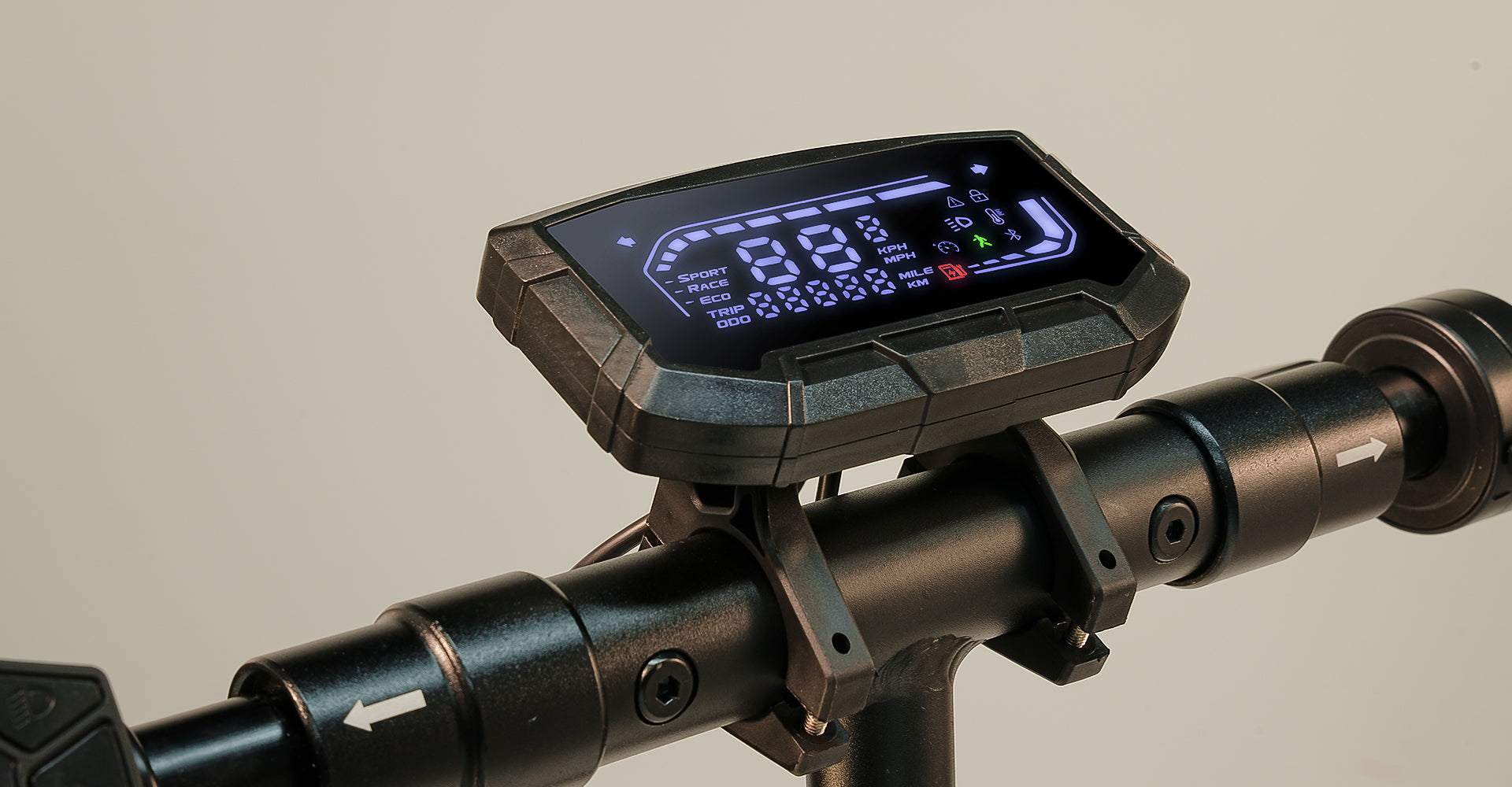 Close-up of an electric scooter LED display mounted on the handlebar, showing speed, riding mode, battery level, and trip information on a bright digital dashboard.