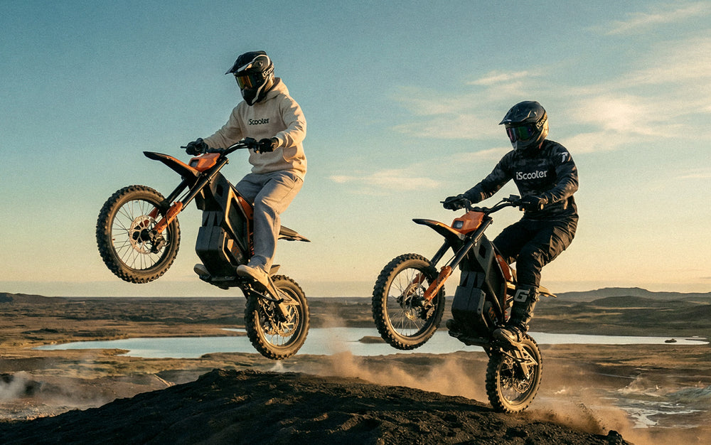 MT2 electric dirt bike riding over a rocky off-road trail to demonstrate front and rear suspension performance and shock absorption.