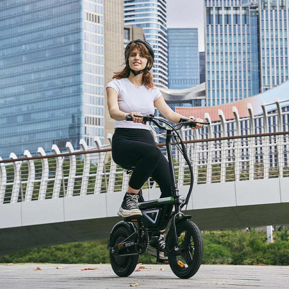 Sustainable urban transportation featuring a woman riding a compact EB1S electric bike in a clean, modern city setting.