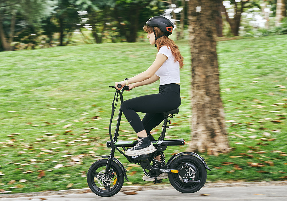 Rider enjoying the EB1S electric bike in a park, showcasing comfortable, eco-friendly commuting and everyday riding.