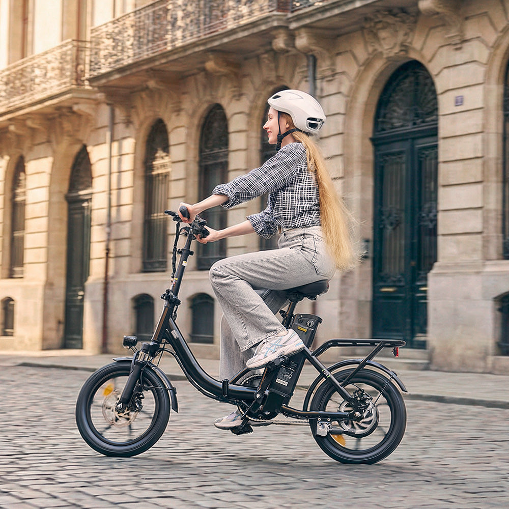 Lifestyle collage showing a couple riding compact folding electric bikes in a park and lakeside setting. The four images feature solo rides, riding together, and a picnic beside the bikes, highlighting comfortable commuting and outdoor leisure use.