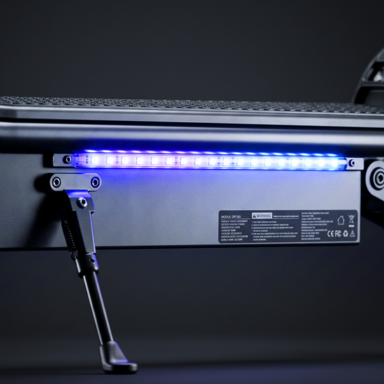 Illuminated blue LED strip light along the side frame of an electric scooter.
